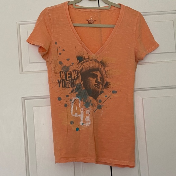 American Eagle Outfitters Tops - American Eagle Outfitters Orange V-Neck Statue of Liberty Graphic Tee